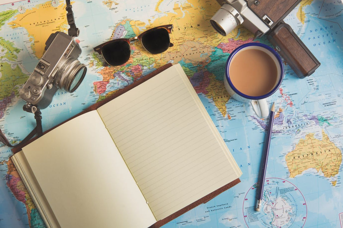 a map, book, and camera