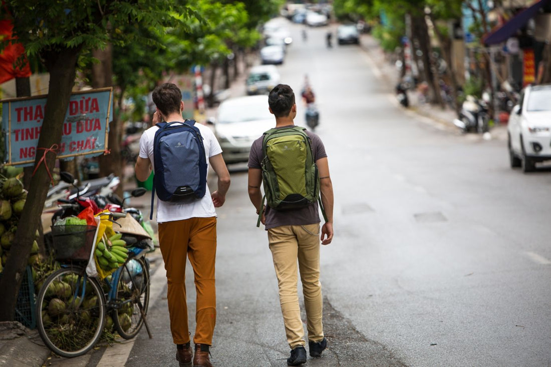 two guys walking down a Vietnam street